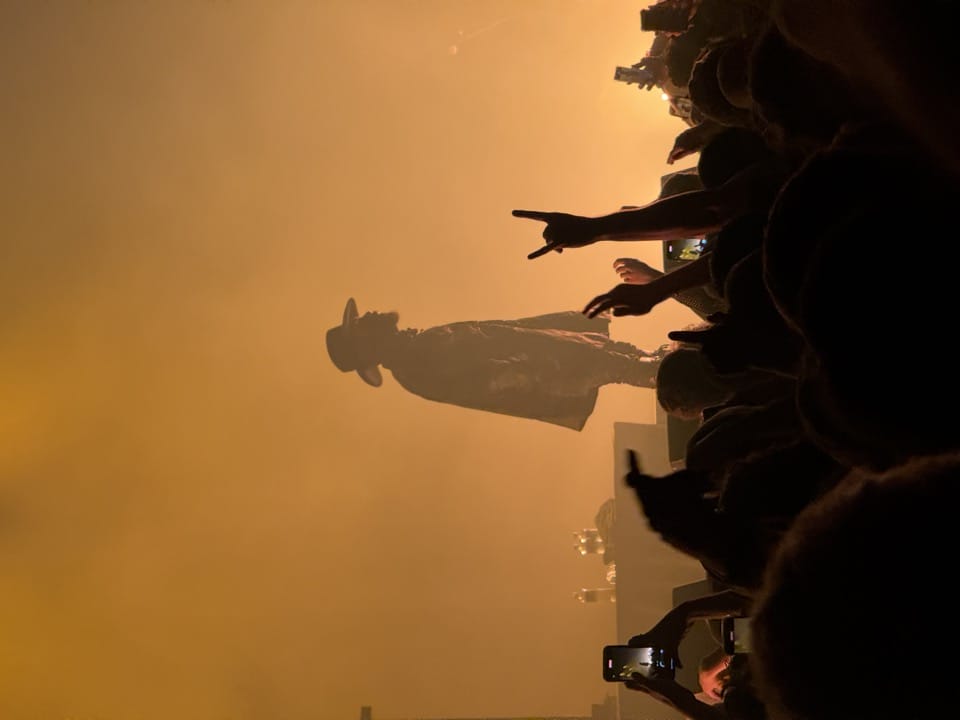 JPEGMAFIA performing on stage, shrouded in fog