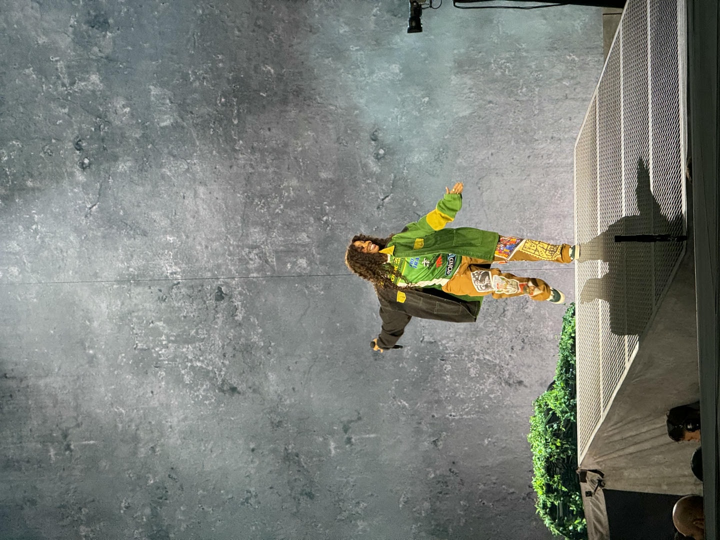 SZA dancing on stage.