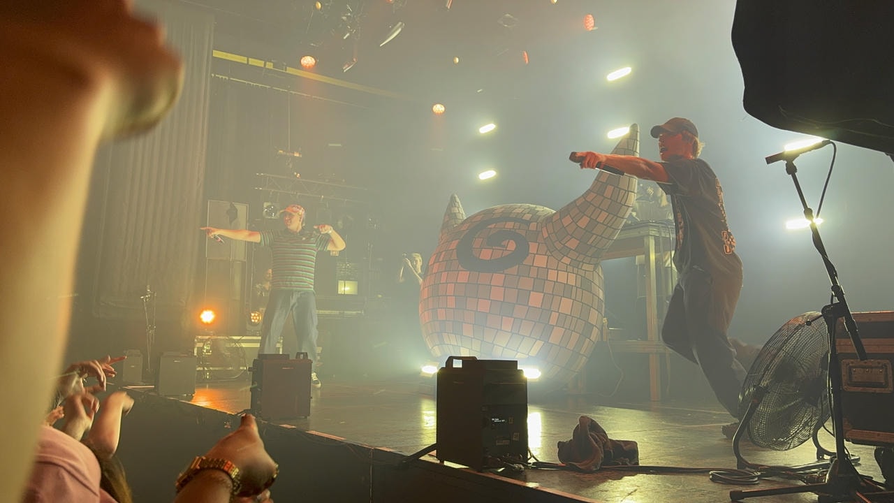 Joey Valence (right) and Brae (left) performing live on stage