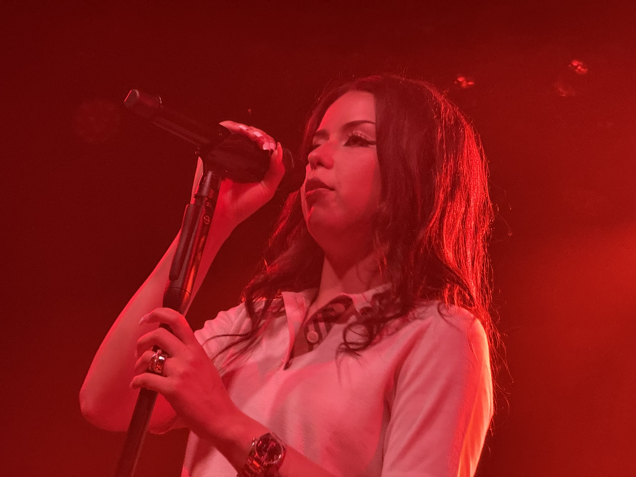 Lexa Gates performing live on stage.