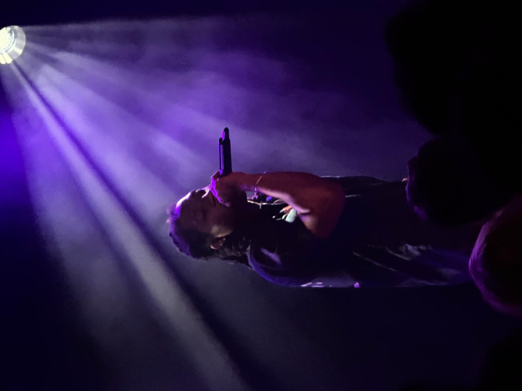Kenny Mason performing on stage.