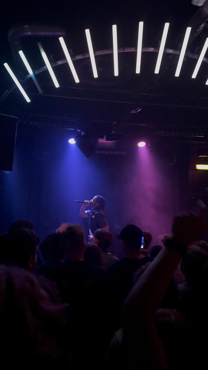 Kenny Mason performing on stage.