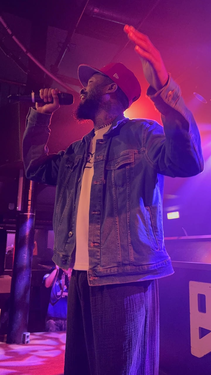 Lute performing on stage.