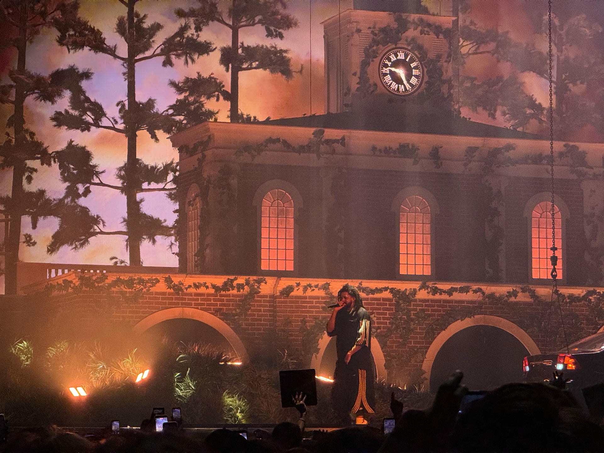 Wide shot of J. Cole performing on stage.